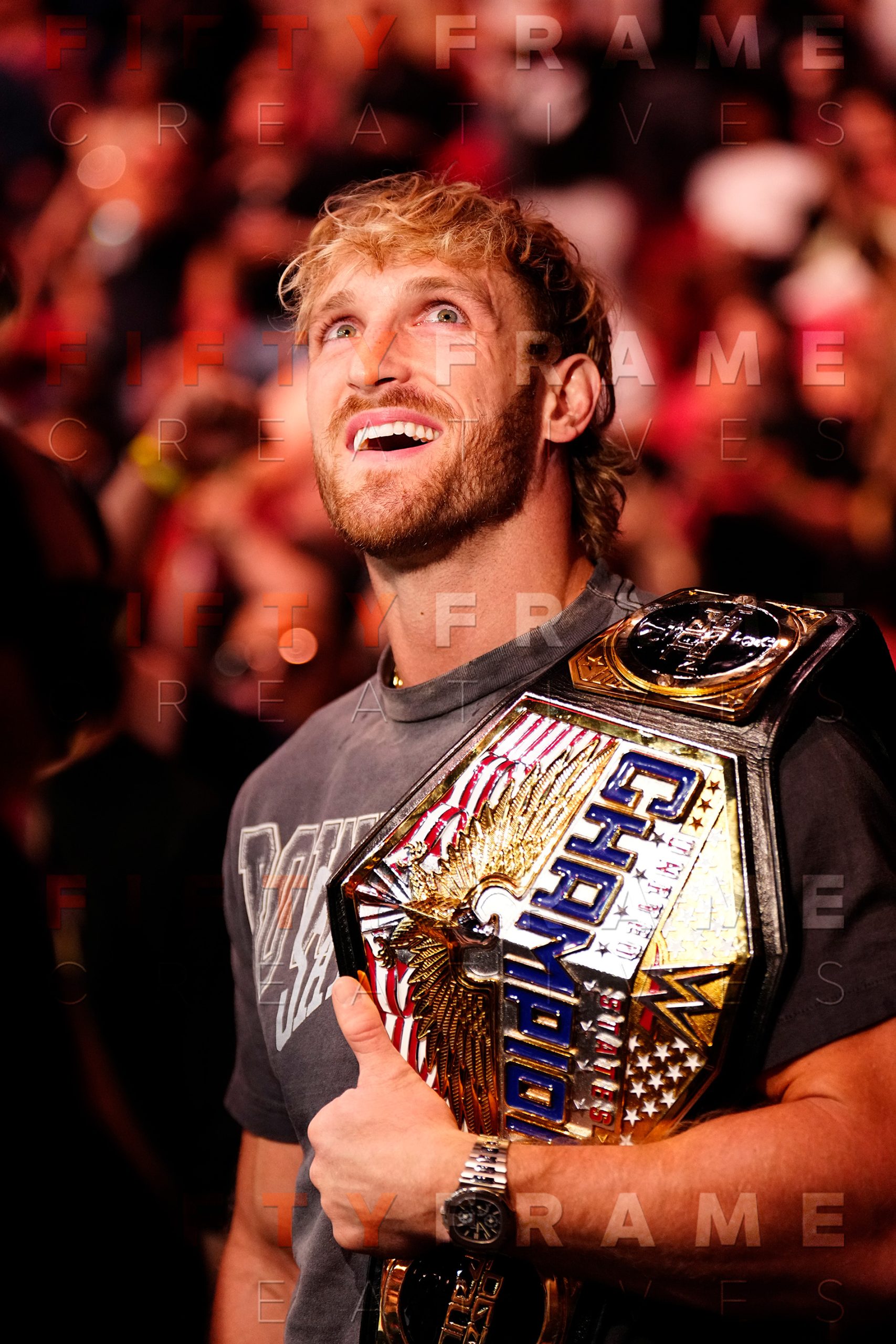 Logan Paul celebrating with the WWE United States Championship belt - Professional Sports Entertainment Photography by Louis Grasse for Fifty Frame Creatives.