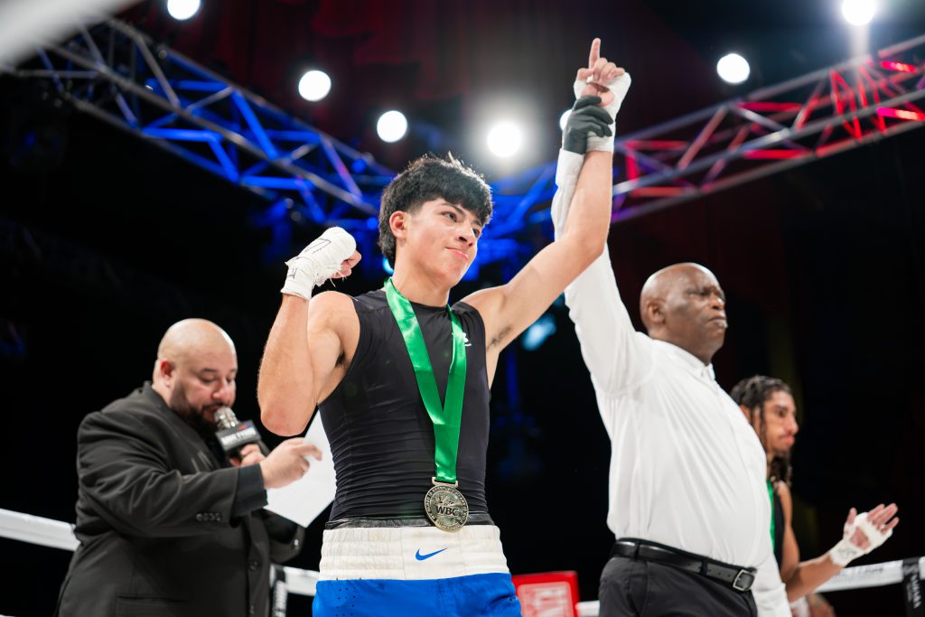 mike-tyson-invitational-2-mti2-boxer-victory-arm-raised-medal-photo-by-eric-nguyen-fifty-frame-creatives